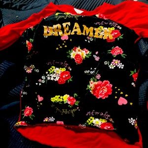 A shirt and it had dreamer on it